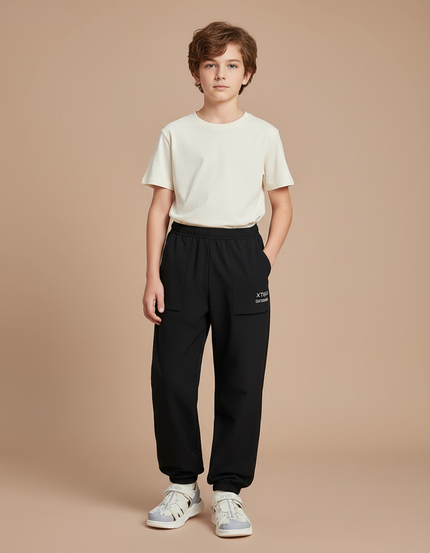 Pantalon Parachute Noir Ample Sport Enfant Respirant - Polyester